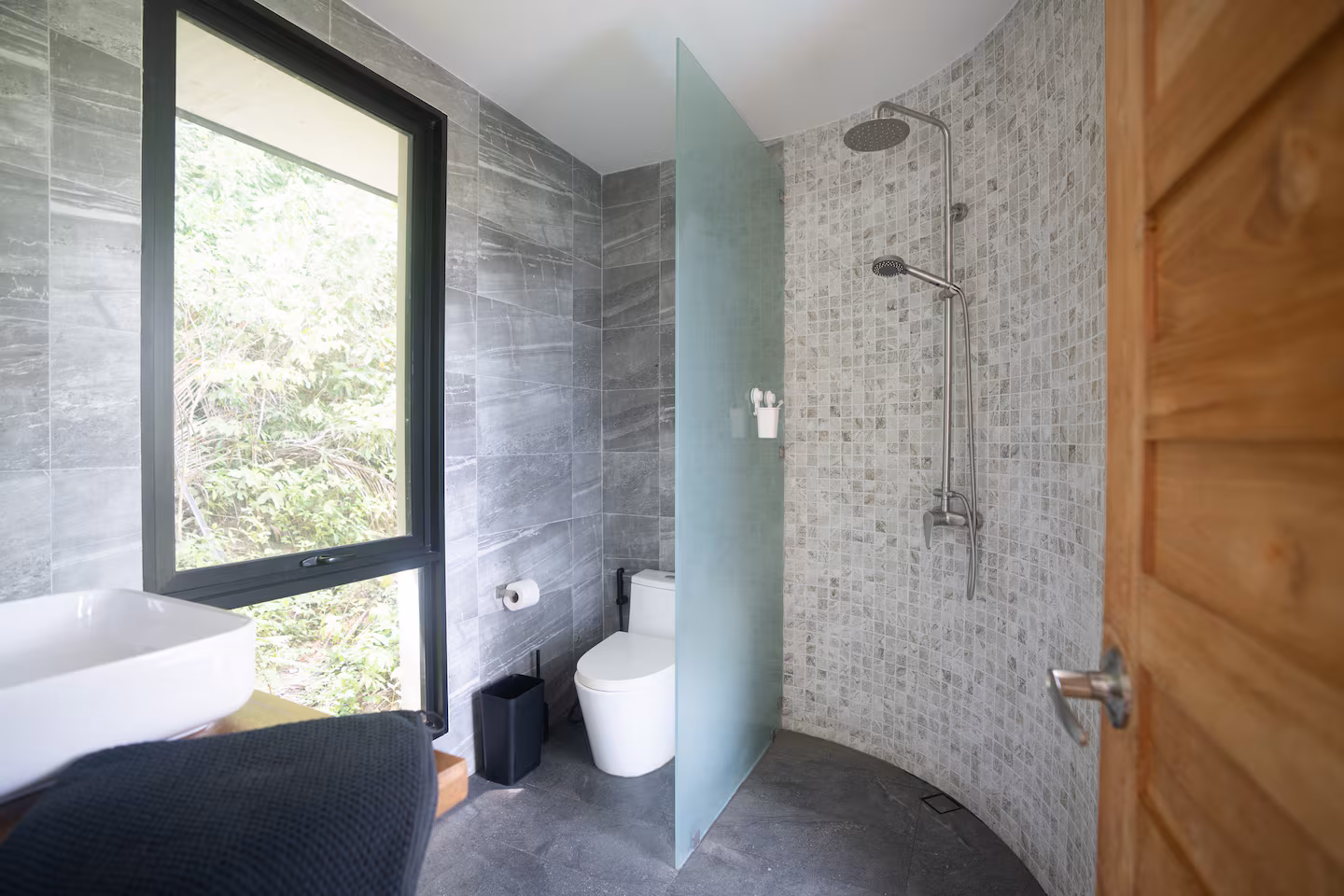 The Nest ensuite bathroom with rainfall shower at Kin Haus