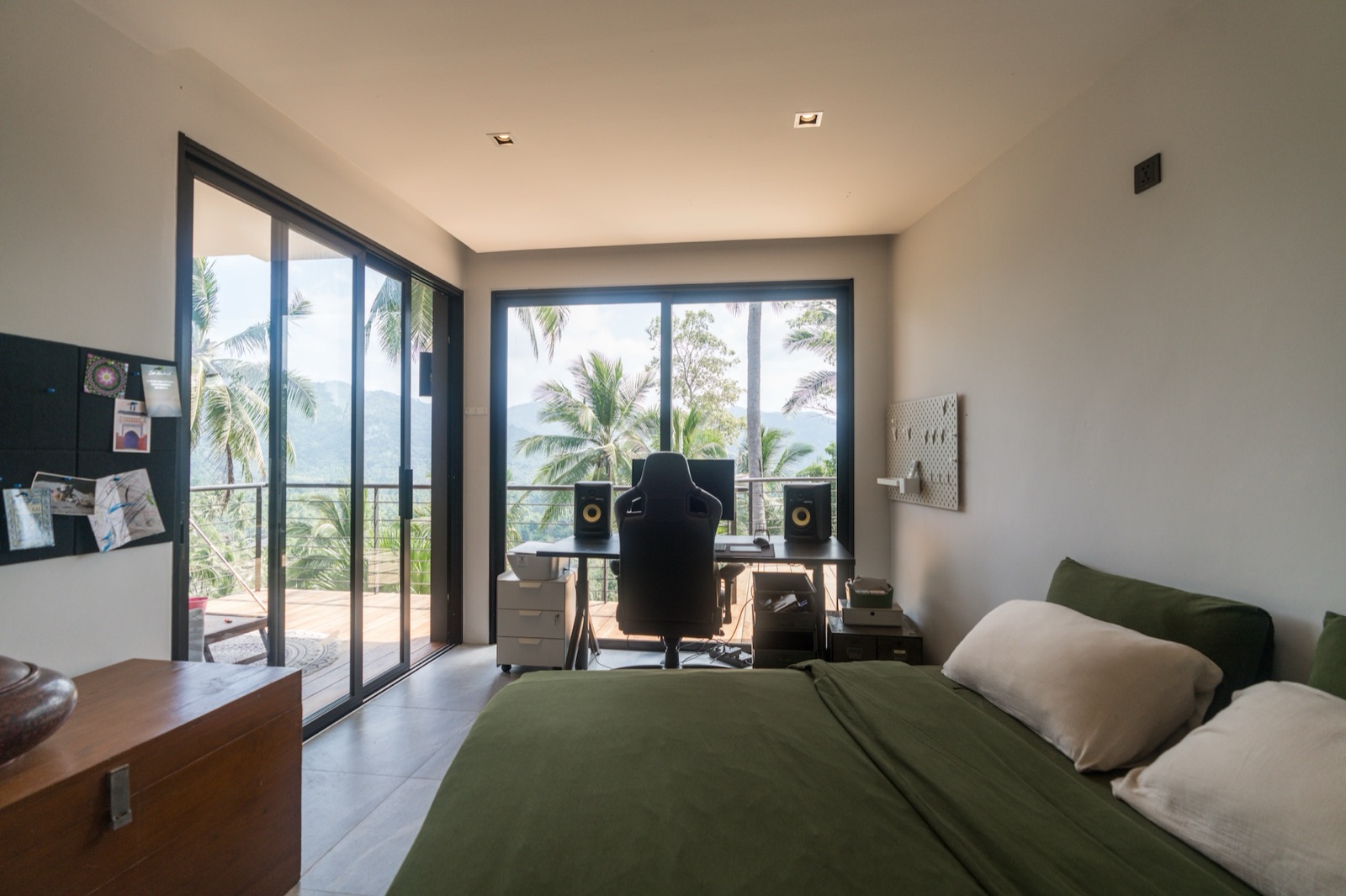 The Nomad room with king-size bed and private desk at Kin Haus, Koh Phangan
